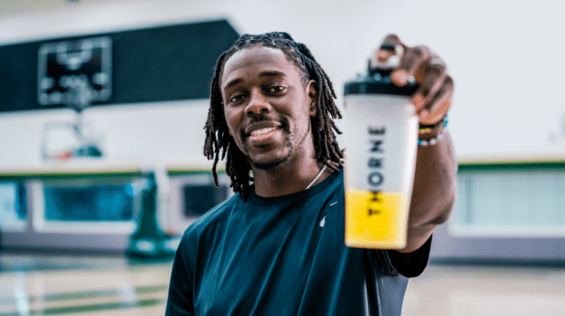 Jrue Holiday holding a Thorne shaker bottle, NBA Champion and sponsored Thorne athlete