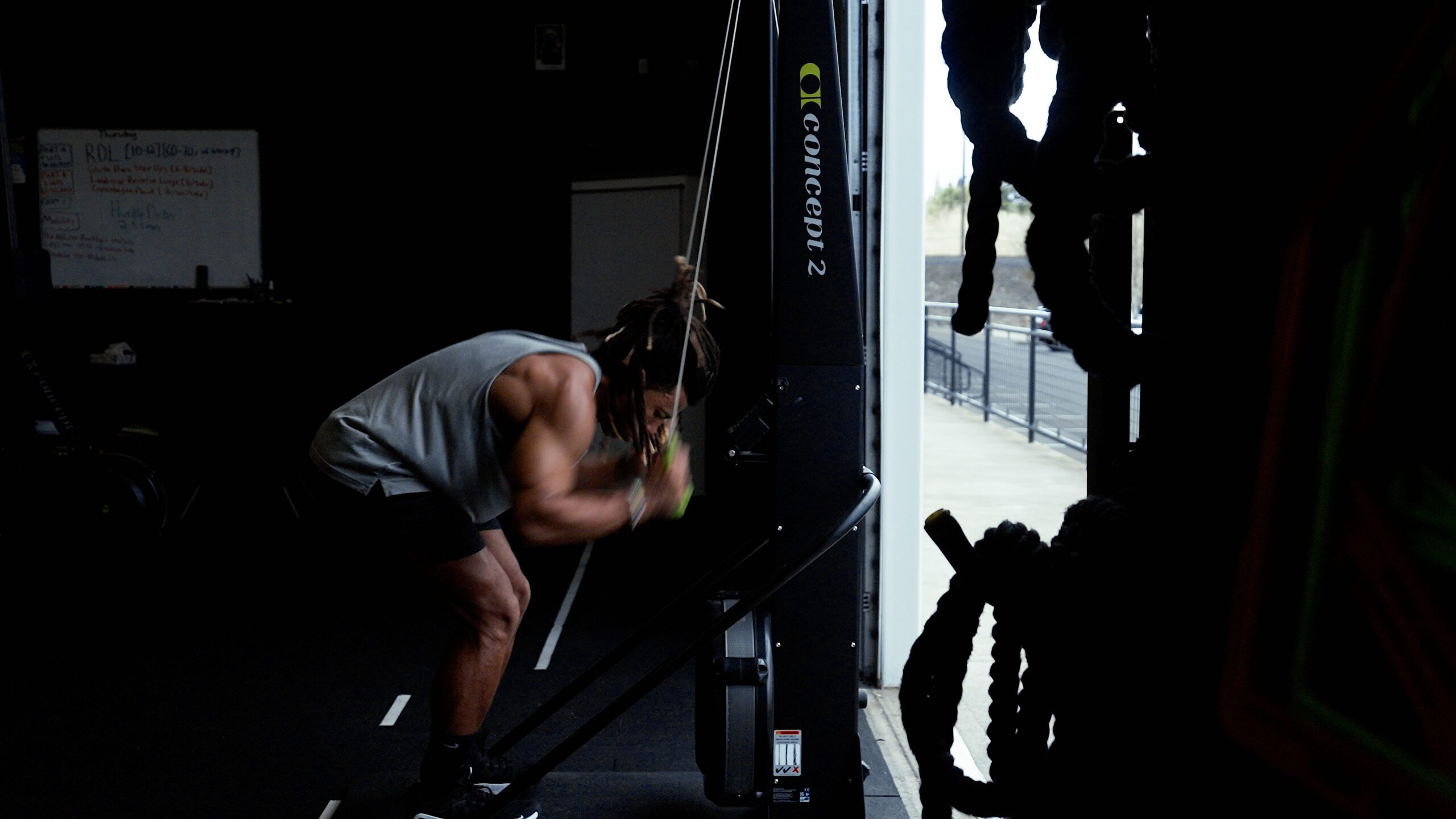 Athlete on a Concept 2 SkiErg during a Hyrox simulation in Portland at APEX PWR Tigard — station 1 of the official Hyrox race format