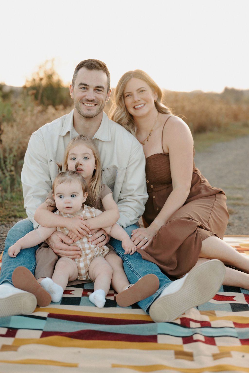 Colin Feldtman with his wife Katlyn and daughters Hughes and Monroe, now coaching personal training and sports performance at APEX PWR in Tigard, Oregon