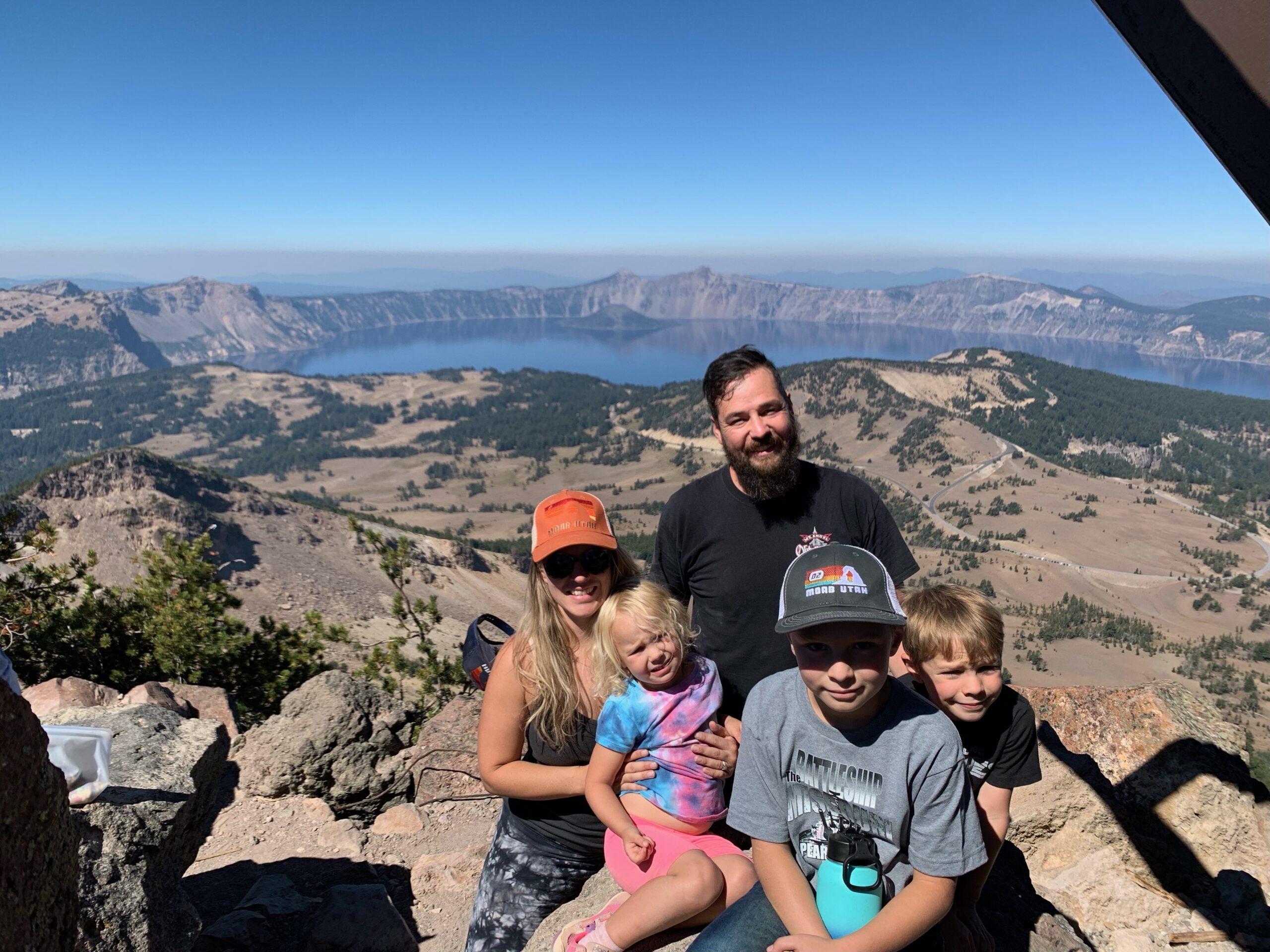 Annie and Eric Wise with their three children at a high-elevation lake overlook in the Pacific Northwest, illustrating the active outdoor lifestyle supported by 4 years of consistent strength training at APEX PWR