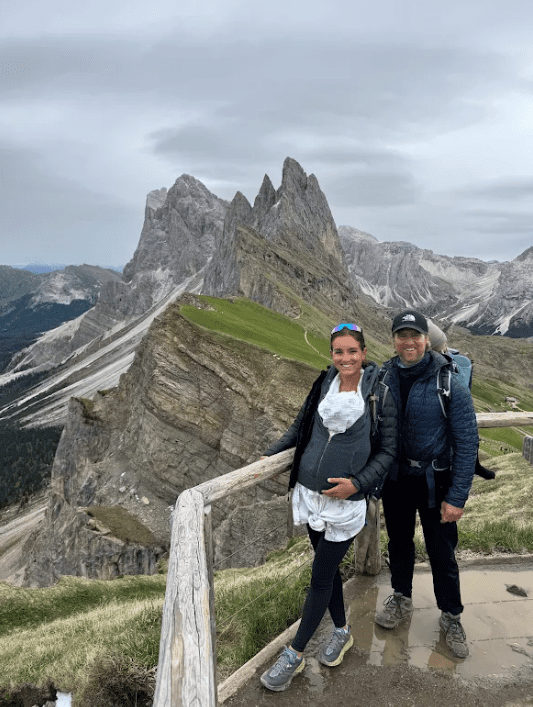 Jennie Carolan, APEX PWR nutrition coach, hiking in the Dolomites with her husband during a month-long family trip through Europe
