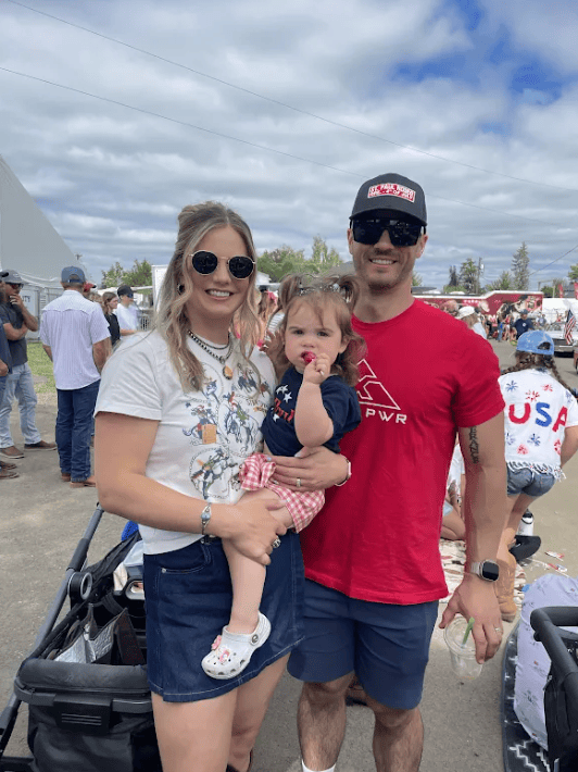 Colin Feldtman, CSCS, with his wife and daughter in the grandstand at the St. Paul Rodeo in Oregon