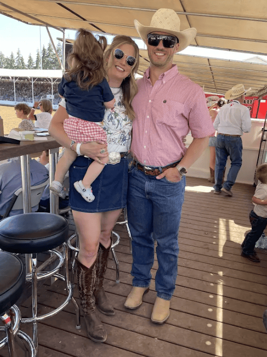 Colin Feldtman and his wife in the stands at the St. Paul Rodeo in Oregon