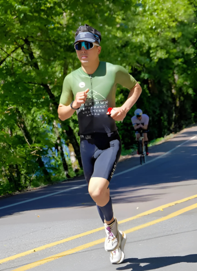 Dr. Kevin Le, DPT, triathlon champions celebrating, Kevin and Batya, first place finishers, APEX PWR athletes, endurance meets recovery, strength through sport, triathlete physical therapist, training for Kona, performance-driven rehab, Tigard OR clinic, VO2 Max testing, DEXA body scans, weekly Run Club, community endurance support